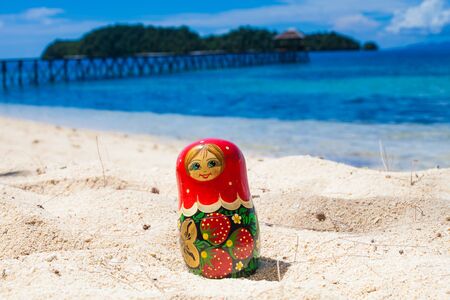 Photo Russian Dolls Matrioshka Untouched Tropical Beach in Bali Island. Horizontal Picture. Blurred Background. Closeupの写真素材