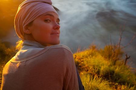 Portrait Young Pretty Girl Sunrise Mountains.Africa Nature Morning Volcano Viewpoint.Mountain Trekking,View Landscape.Woman Engaged Yoga Meditation.Horizontal picture.First Rays Rising Sunの写真素材