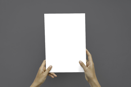 Closeup Blank White Paper Sheet Mockup Holding Female Hands Abstract Gray Backgroundの写真素材