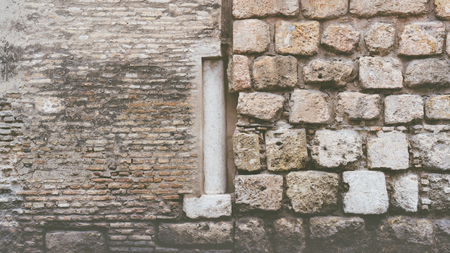 Old stone wall, old texture of natural color authentic stones blocks closeup.Background of stone wall textureの写真素材