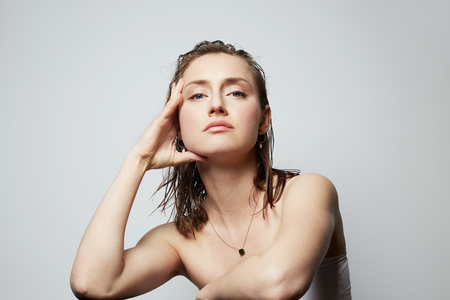 Beauty portrait of a teen female with natural makeup over white background. Cosmetology and Advertisement.の写真素材