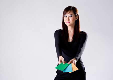 woman presenting colored cards