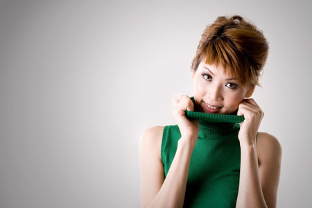 woman smiling while flipping collarの写真素材