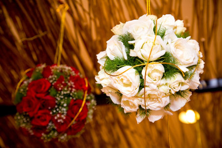 roses bouquet ball hanging as decoration on wedding celebrationの写真素材