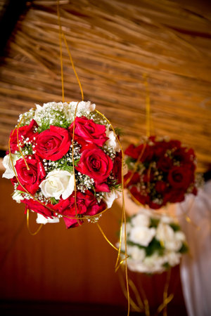 roses bouquet ball hanging as decoration on wedding celebrationの写真素材