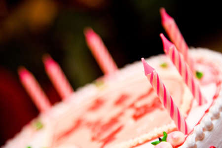 candles on a birthday cake ready to be litの写真素材