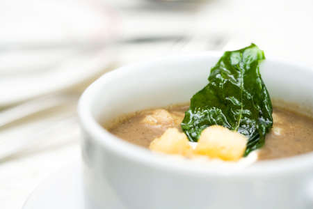 a bowl of creamy soup before the main courseの写真素材