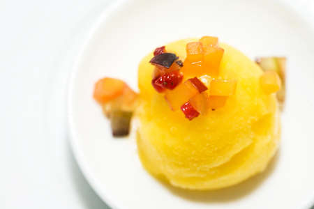 a scoop of sorbet ice cream is served as dessertの写真素材