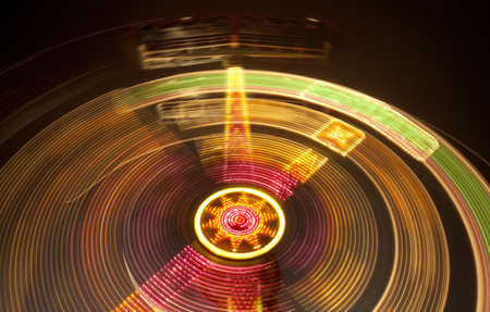 Long exposure night shot of the Kamikaze ride at the carnival midway  also known as a Double-Arm Ranger, The Apollo, or the Skymaster   のeditorial素材