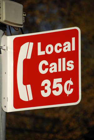 Local Calls Sign above Public Pay Phone                                  の写真素材