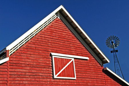 Red Barn with a windmill in the backgroundの写真素材