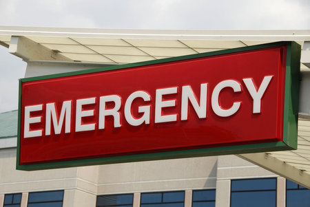 Emergency Sign over a Hospital Emergency Room Entranceの写真素材