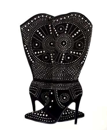 A Black Velvet Boots with Metal Studs on a White Backgroundの写真素材