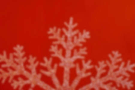 Blur Background Image of a Snowflake isolated on Redの写真素材