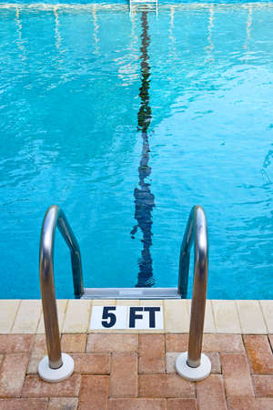 Swimming Pool Ladder and Water Depth Markerの写真素材