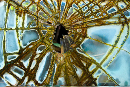 Broken Side Glass on an Old Car in a Junk Yard