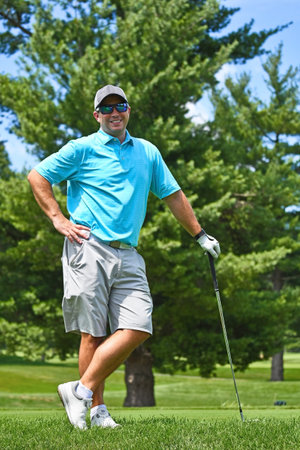 Young Man Playing a Round of Stops and Poses for a Photograph. の写真素材