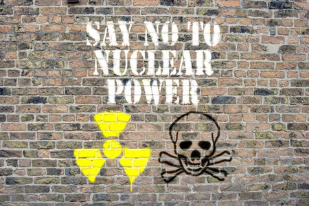 Say no to nuclear power sprayed on brick wall