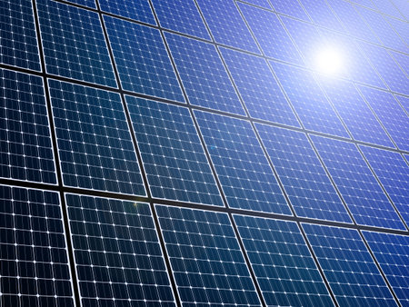 Large array of solar panels with sunlight reflection