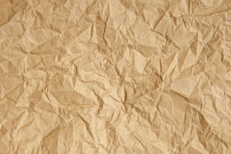 Crumpled brown parcel packing paper background textureの写真素材