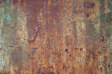Rusty old metal panel with decaying and corroded surface
の写真素材