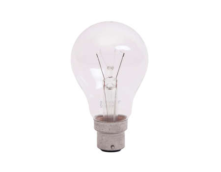 Isolated old filament light bulb with bayonet fittingの写真素材
