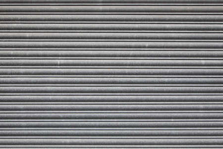 Metal roller shutter door. Security grill backgroundの写真素材