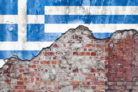 Greece wall. Grungy old brick wall with Greek flag on broken render surfaceの写真素材