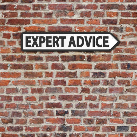 Expert advice black and white sign on brick wall backgroundの写真素材