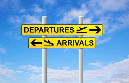 Arrivals and departures airport direction sign on blue skyの写真素材