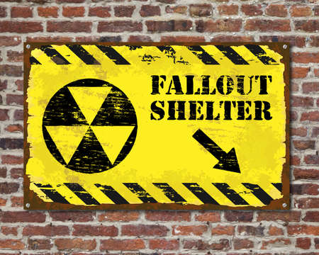 Grungy fallout shelter sign on brick wallの写真素材