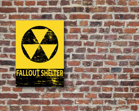 Grungy fallout shelter sign on brick wall
の写真素材