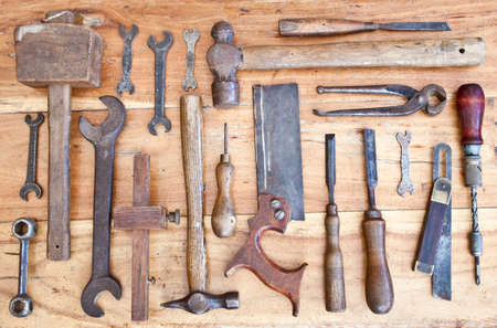 Old woodwork tools on grungy wooden bench background
の写真素材