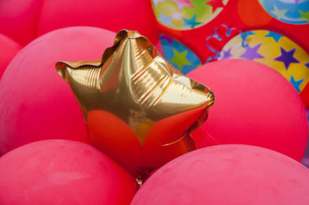 Shiny golden star balloonの写真素材