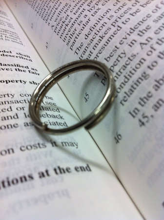 Love in the office - heart shadow on text book. の素材