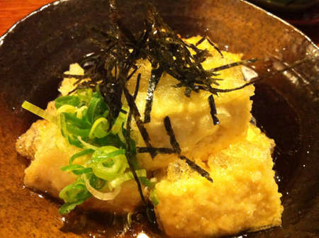 Japanese extra silky soft sweet fried tofu on dark soy sauce の素材