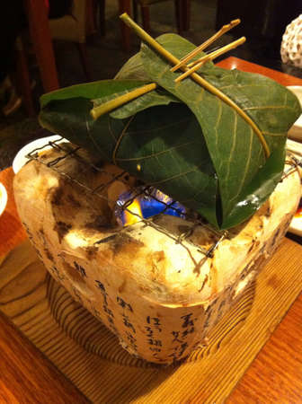 DIY homemade Japanese seafood mixed grilled on giant banana leaf on fire stone stoveの素材