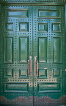 Big metallic green doorsの写真素材