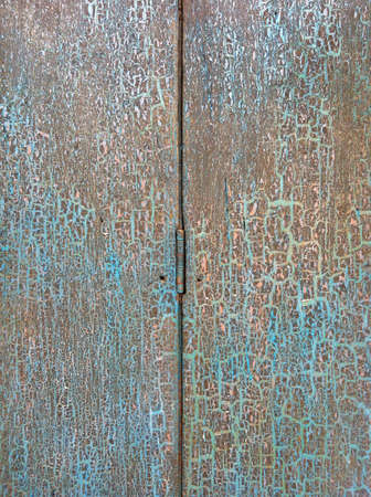 Vintage cracked wooden door in Chantaburi village in Thailand の素材