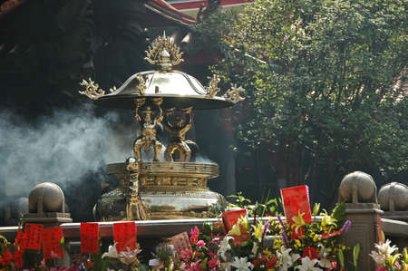 Chinese incense sticks burner in templeの写真素材