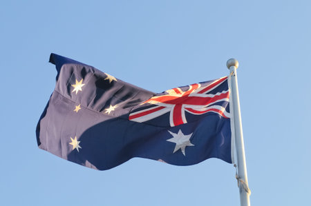 Waving Australia National Flag in windy dayの写真素材