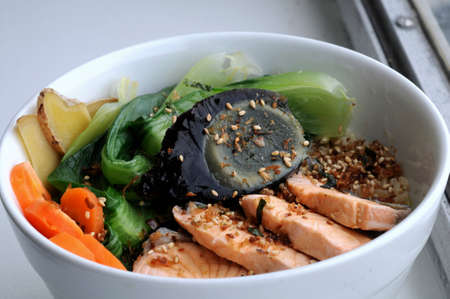 Japanese salmon with mixed salad on riceの写真素材