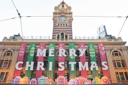 Christmas greeting from Flinders St  Train station in Melbourne Australiaのeditorial素材
