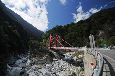 Metallic red bridge in Taroko Gorge in Taiwanの写真素材