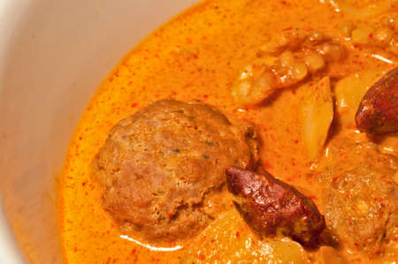 Thai yellow Massaman curry with minced meatball and almondsの写真素材