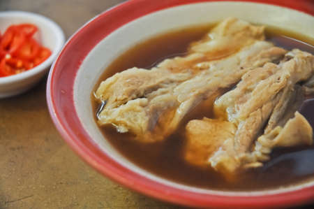 Bak Kut Teh hearty oriental herbal dark soup of pork spare ribsの写真素材