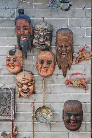 Holy warrior monks wooden carved masks in Chinaの写真素材