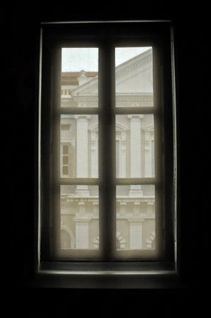 Window lookout mysterious scene to European houseの写真素材