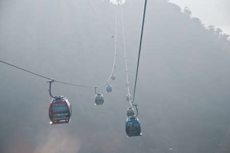 Nantou Taiwan  January 31 2015: Tourist cable cars are going up to the mountain in Sun Moon Lake area in Nantou province in Taiwan. This photo is taken in the late afternoon. There are tourists in many cable cars. The cable cars are going up to Taiwanese のeditorial素材