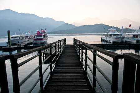 Nantou Taiwan  February 1 2015: Sun Moon Lake jetty in Nantou province in Taiwan. This photo is taken in the early morning. There are many tourist boats parking.のeditorial素材